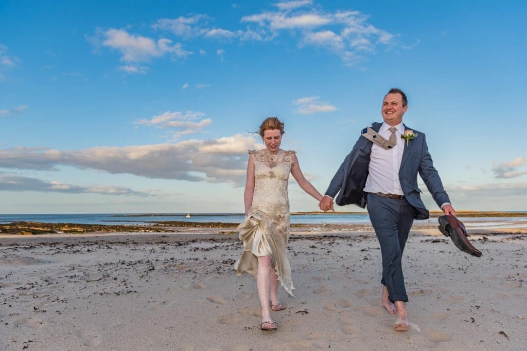 Wedding Beach Photography by Bevan Cockerill Couple walking on sand