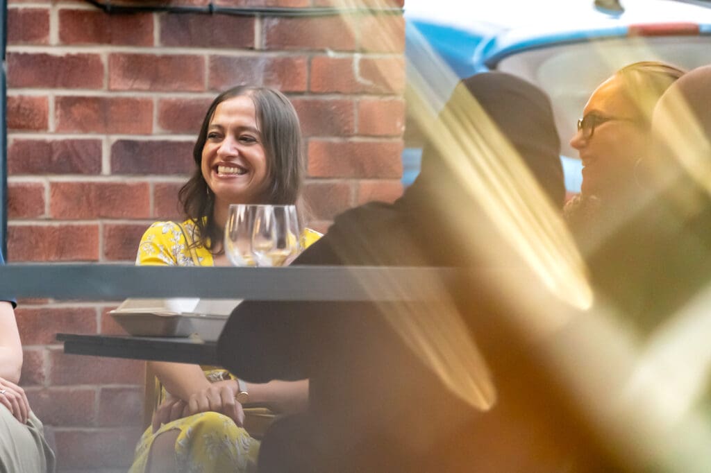 Restaurant Photography, lady smiling at table
